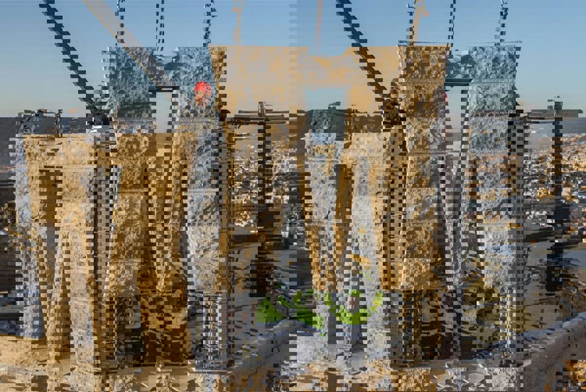 Prefabricated concrete parts being lowered into place