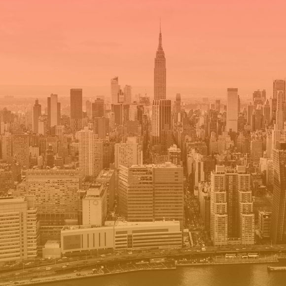 A city skyline with a river.