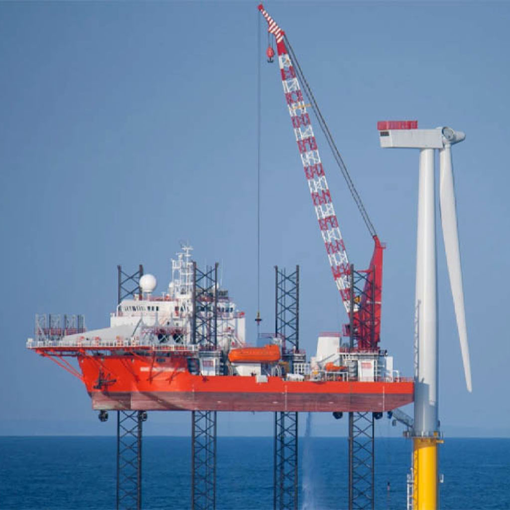 A large red and white oil rig.