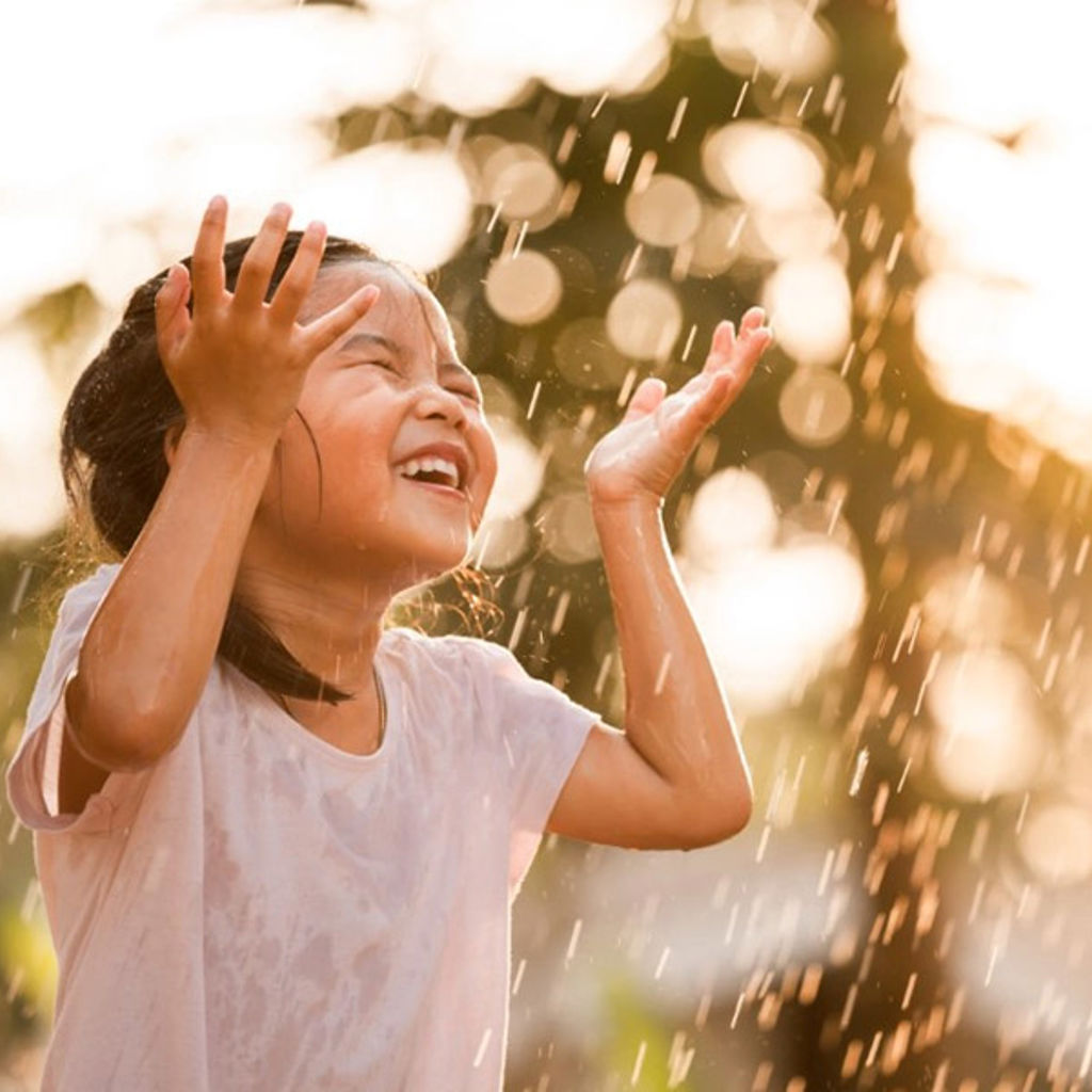 Child playing in water fountain - cities will need to rethink how they approach the sourcing of water