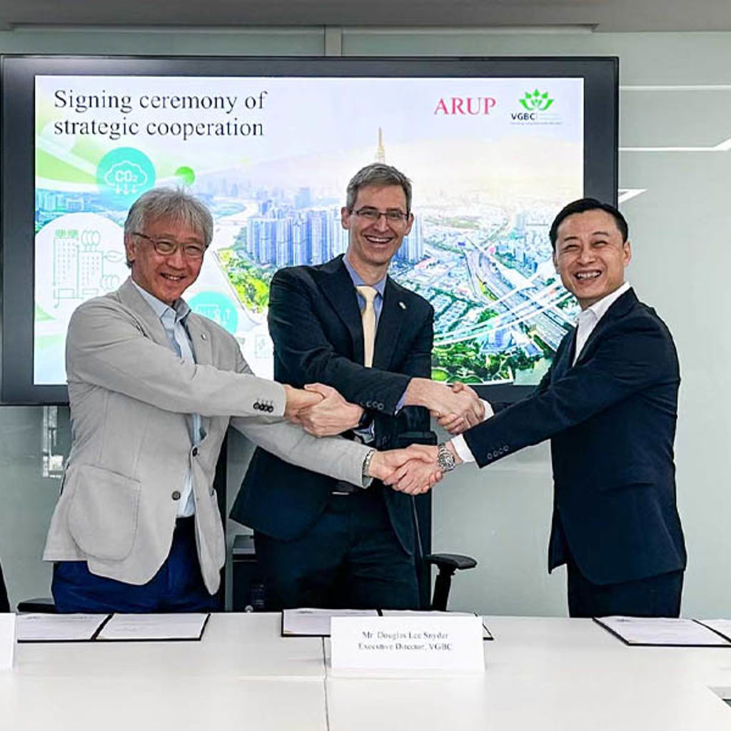 A group of men shaking hands.