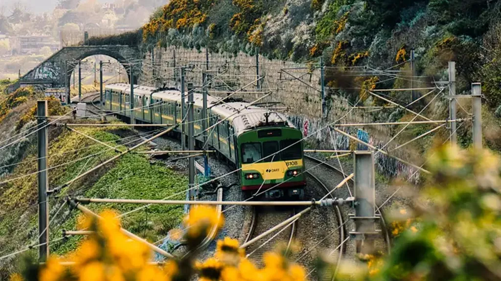 Electric train running along a coastal track