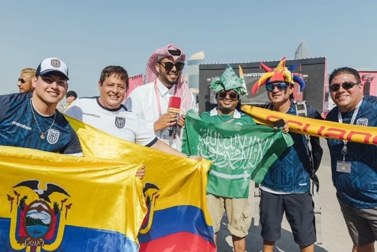 A group of people holding a flag.