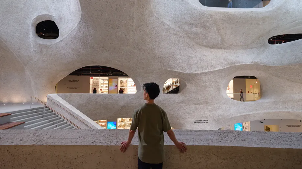 A man walking up a staircase.