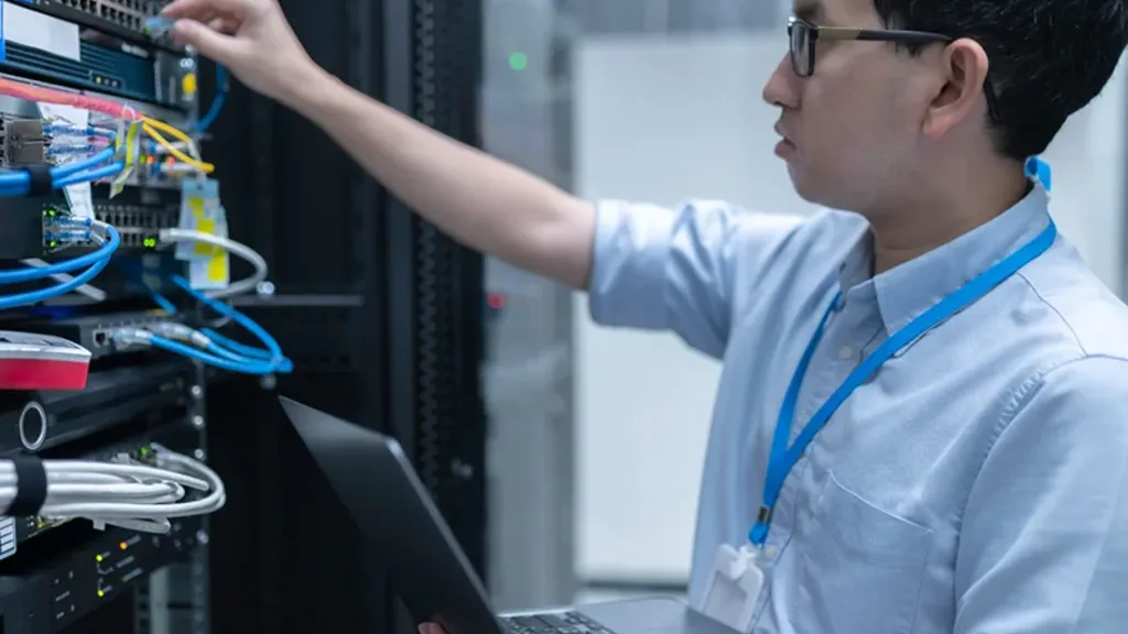 A person working on a laptop.
