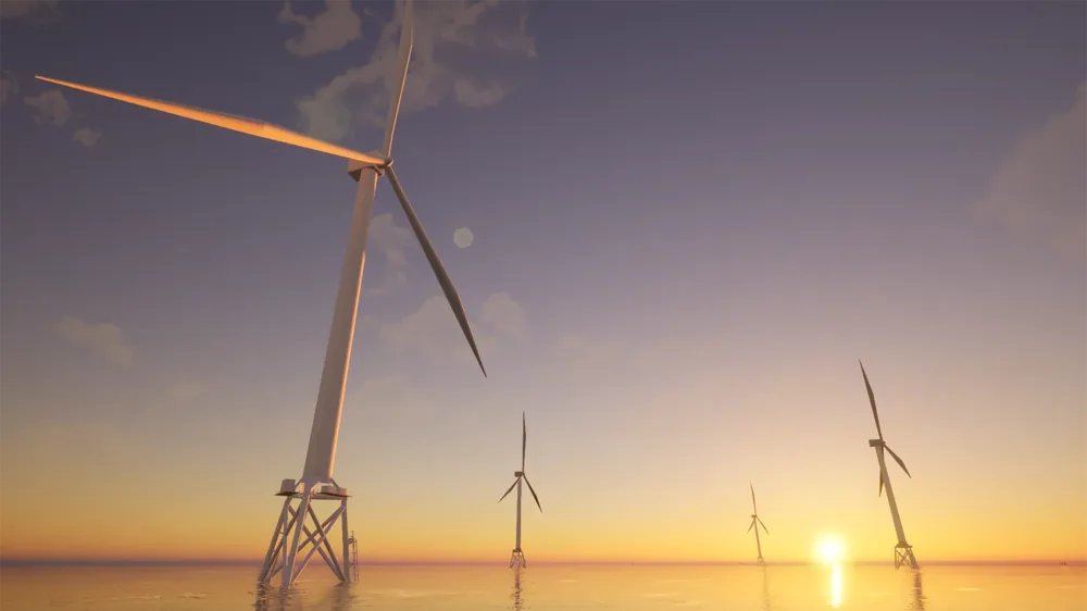 A group of offshore wind turbines at sunset