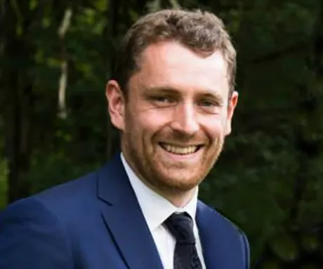 A man in a suit and tie.